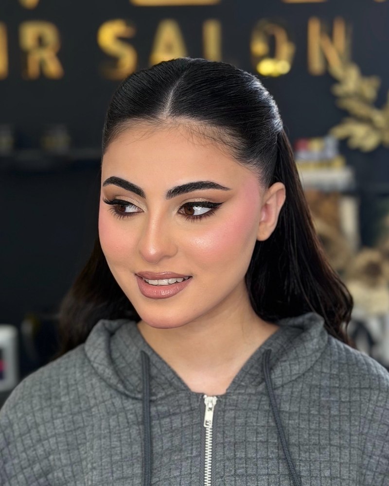 Sleek half-up and makeup